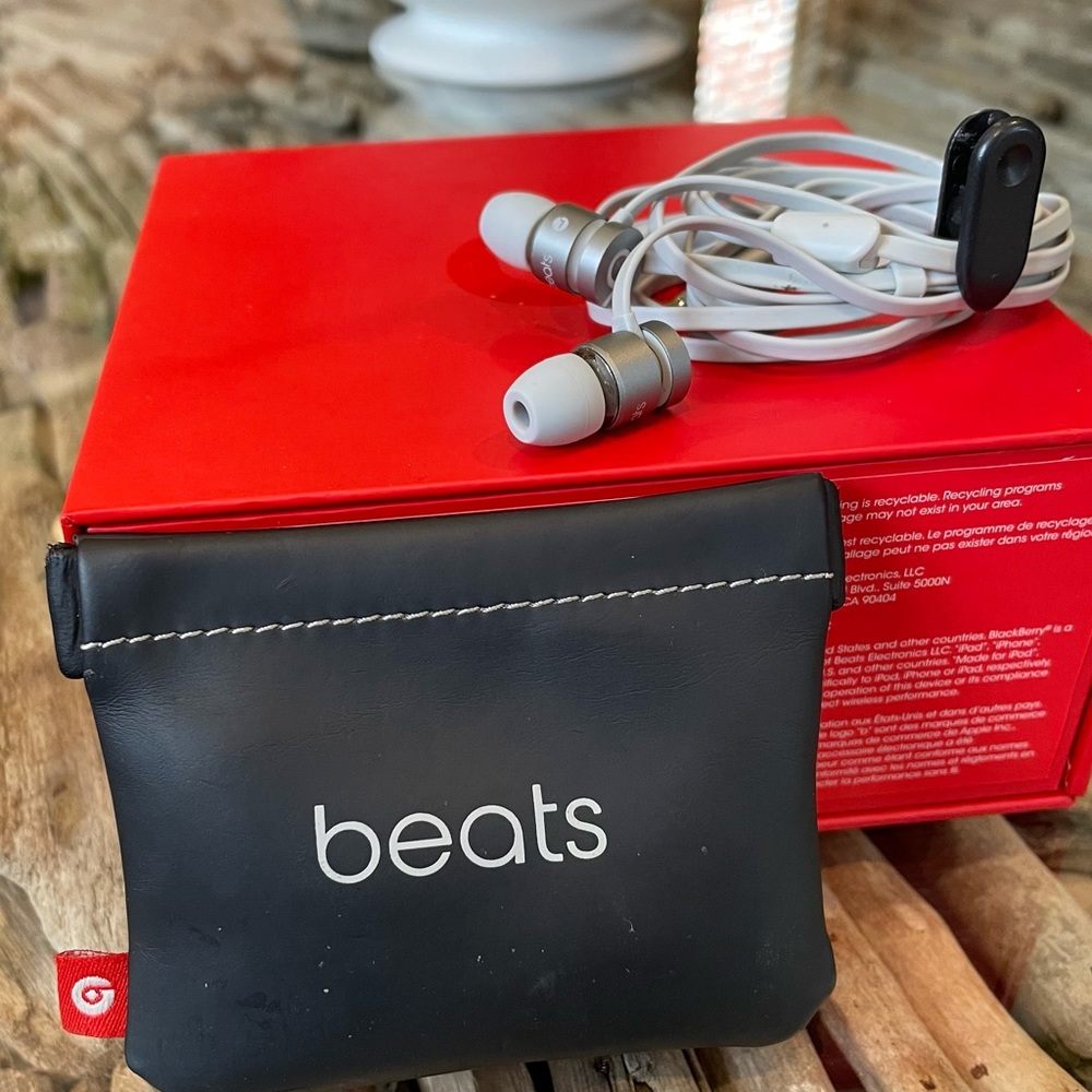 Beats in-ear headphones in a silver grey color